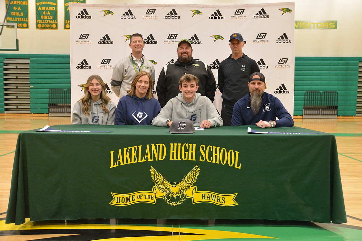 Courtesy photo
Lakeland High senior Blaze Day recently signed a letter of intent to play baseball at NCAA Division III George Fox University in Newberg, Ore. Seated from left are Kindell Day (sister), Alicia Day (mom), Blaze Day and Reggie Day (father); and standing from left, Matt Neff, Lakeland High athletic director; Jason Bradbury, Lakeland High baseball coach; and Jamie Blattstein, club baseball coach.