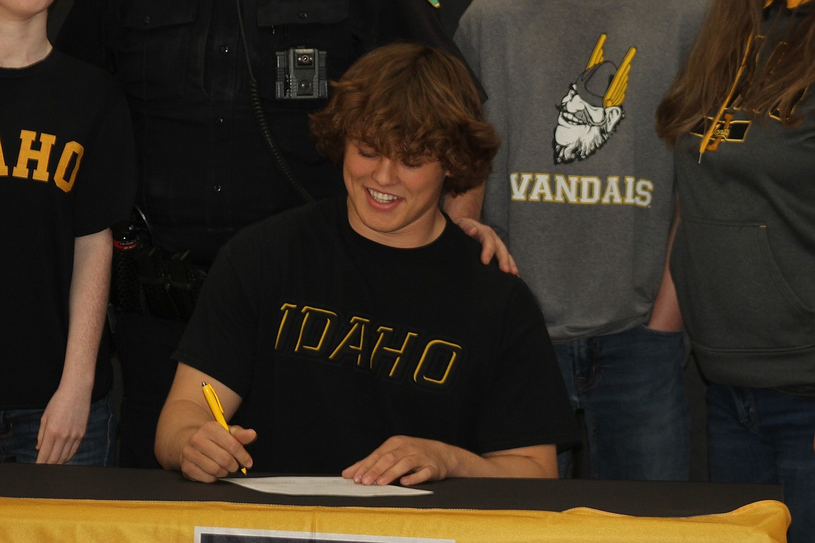 Matyus McLain signs a letter of commitment to play football at the University of Idaho.