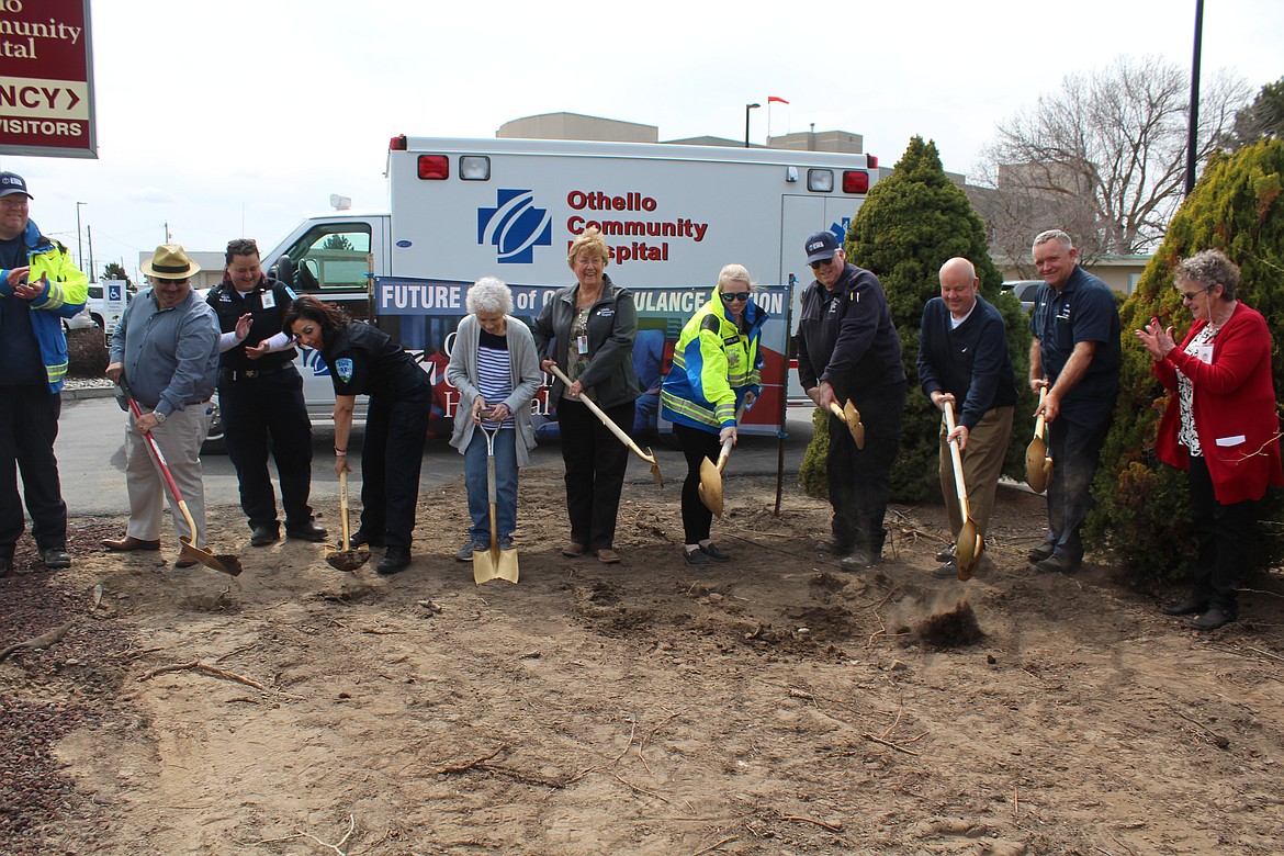 The first shovelful of dirt flies on the site of the new Othello EMS hall outside Othello Community Hospital during a groundbreaking ceremony Monday. From left, EMS personnel Luis Valles, Kele Valles, Zahra Maldonado, Othello Community Hospital commissioners Gayle Bohannan and Shirley McCullough, EMS crew memberTiffany Cutforth, EMS director Jim Lomax, Othello Mayor Shawn Logan, OCH plant operations technician Roger Roylance and OCH administrator Connie Agenbroad.