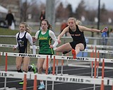 PREP TRACK AND FIELD: Thornton, Barnhart weather elements; Trojans nab team title