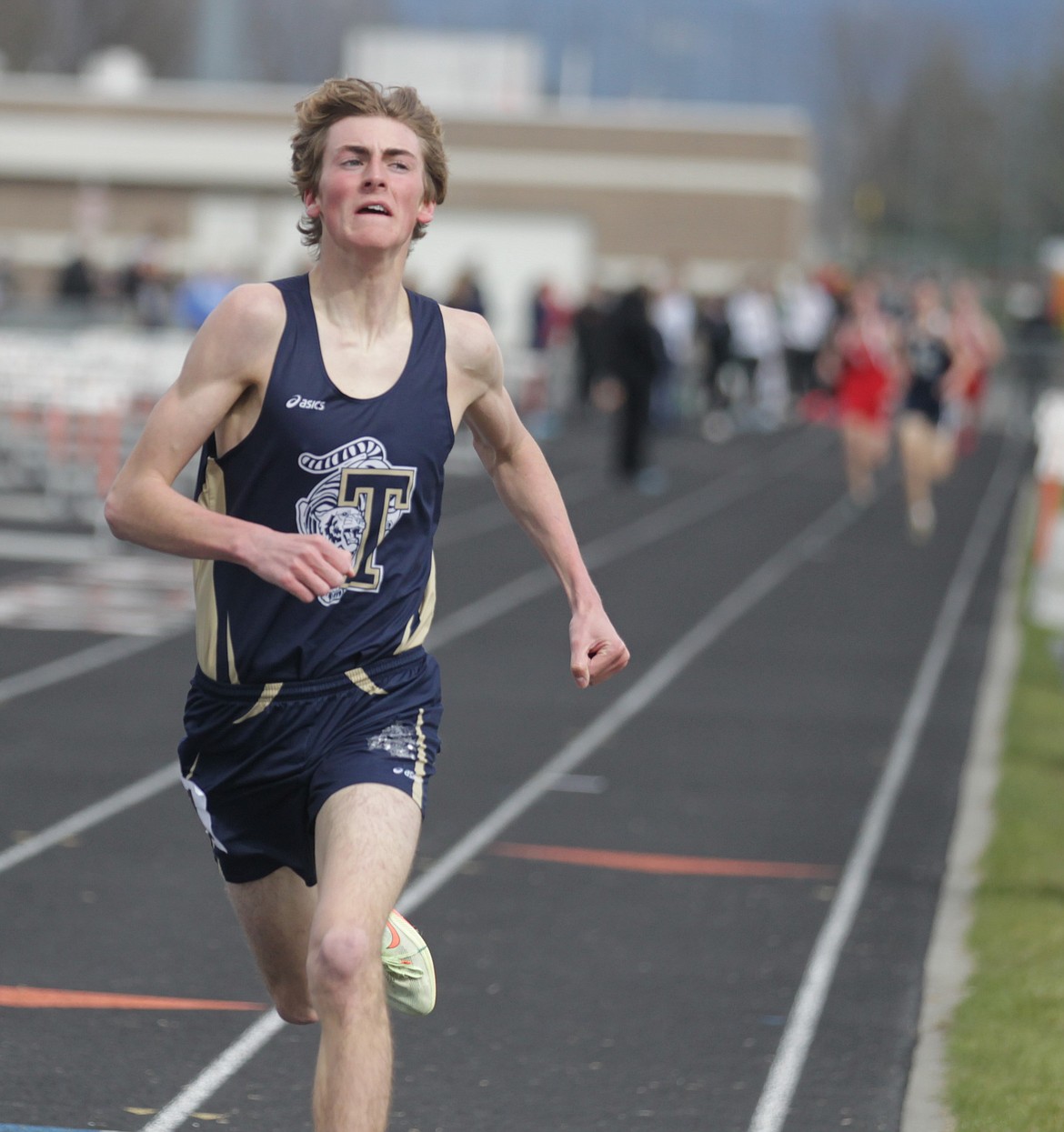 JASON ELLIOTT/Press
Timberlake High junior Jacob Barnhart comes across the finish line during the boys 1,600-meter run during the Christina Finney Relays at Post Falls High on Tuesday. Barnhart won the race in 4 minutes, 34.80 seconds.