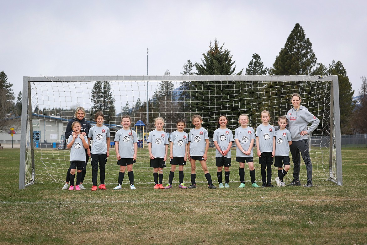 Photo by BUSCEMA PHOTOGRAPHY
The Thorns North FC 14 Girls Yellow soccer team traveled to Sandpoint on Sunday to play against the Strikers for the first game of the spring season, and won 5-1. Thorns goals were scored by Quinn Baily, Allison Legg, Hatty Lemmon and and Stella Hartzell, with an assist by Brielle Buscema. The Thorns will host the Spokane Sounders on Saturday at 10:15 a.m. at Hayden Meadows. From left are Ellie Carper, coach Jean Carper, Brielle Buscema, Allison Legg, Hatty Lemmon, Stella Hartzell, Audrey Rietze, Poppy Moreau, Blaire Warren, Finley Rauscher, Quinn Baily and coach Kara Lemmon.