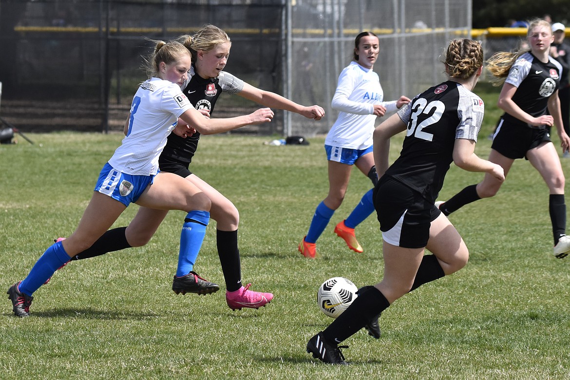 Photo by SUZI ENTZI
The Thorns North FC 08 Girls Academy's back line defends the goal this past weekend during Idaho State League matches. The Thorns beat Albion SC Idaho G08 3-1 on Saturday. Cameron Fischer and Avery Lathen each scored a goal, Mackenzie Mitchell had a goal and an assist. On Sunday the Thorns fell to Idaho Rush 08 Elite 4-0. Thorns pictured in black from left are Nora Ryan, Izzy Entzi and Mackenzie Mitchell.