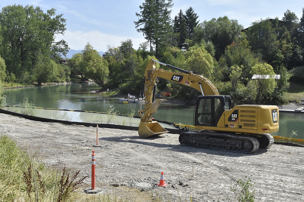 BNSF Railway crews work along the Whitefish River at the Roundhouse Landing river access site in this 2019 file photo. (Heidi Desch/Whitefish Pilot FILE)