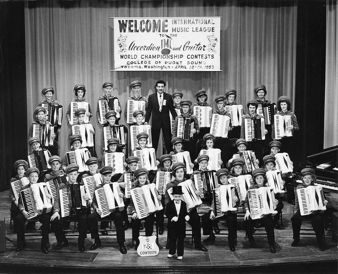 Conductor Joe Carbonatto, Barb Renner (back row, third from right), Mini-Me and 1953 North Idaho Accordion Band.