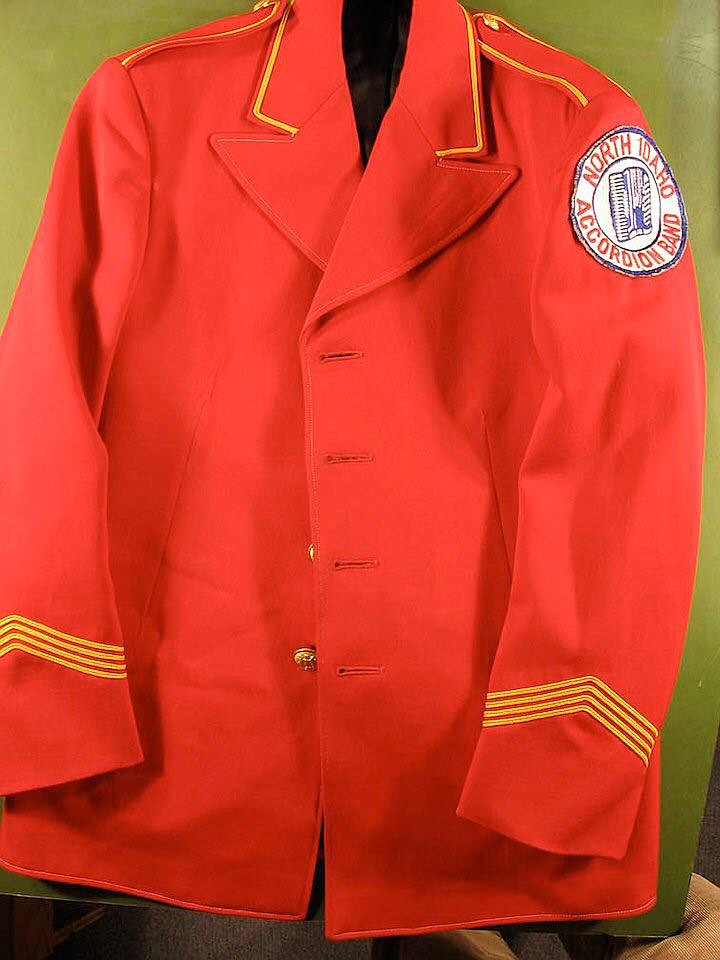 Self-made, red corduroy jacket worn by accordion band members.
