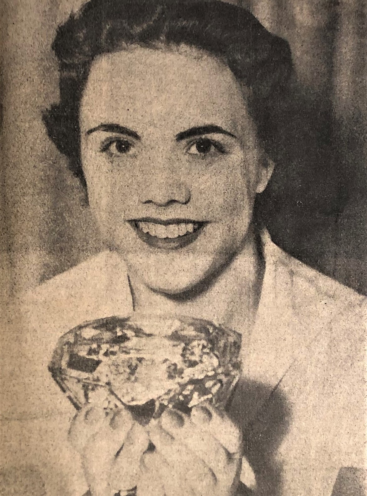 Ruthanna Hawkins, the first Miss Diamond Cup, holds a fake diamond ring.