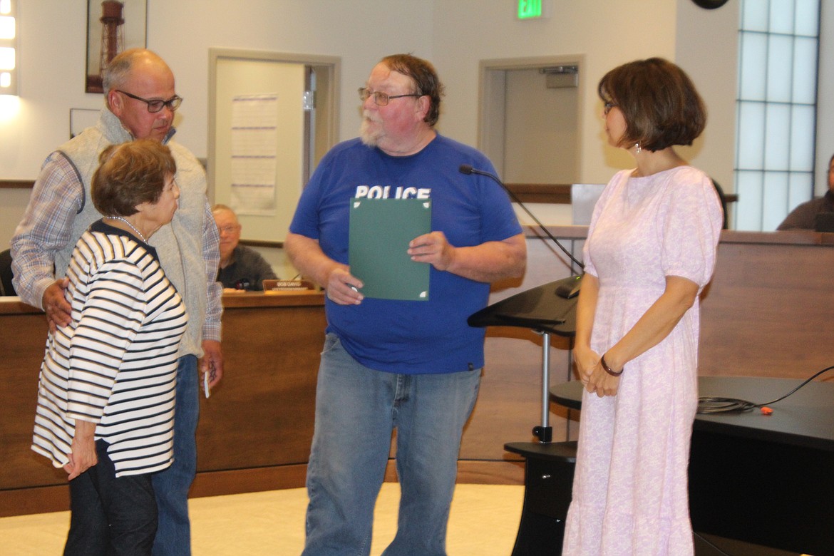 Quincy Mayor Paul Worley, center, presents the “Pride of Quincy” award to, from left, Irma Sepulveda, Charles Sepulvdea Jr. and Lisa Robertson in memory of Charles Sepulveda Sr. at the Quincy City Council meeting Tuesday.