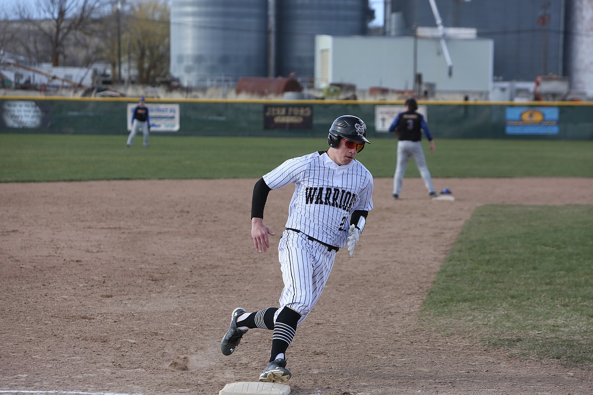 ACH junior John Pierce rounds third base on his way to score a run in the bottom of the fourth inning on Tuesday.