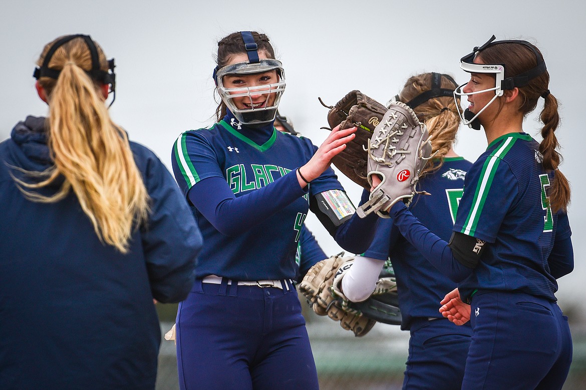 Glacier starting pitcher Morgan Vivian (4) celebrates with the infield after a strikeout against Flathead at Kidsports Complex on Thursday, April 20. (Casey Kreider/Daily Inter Lake)