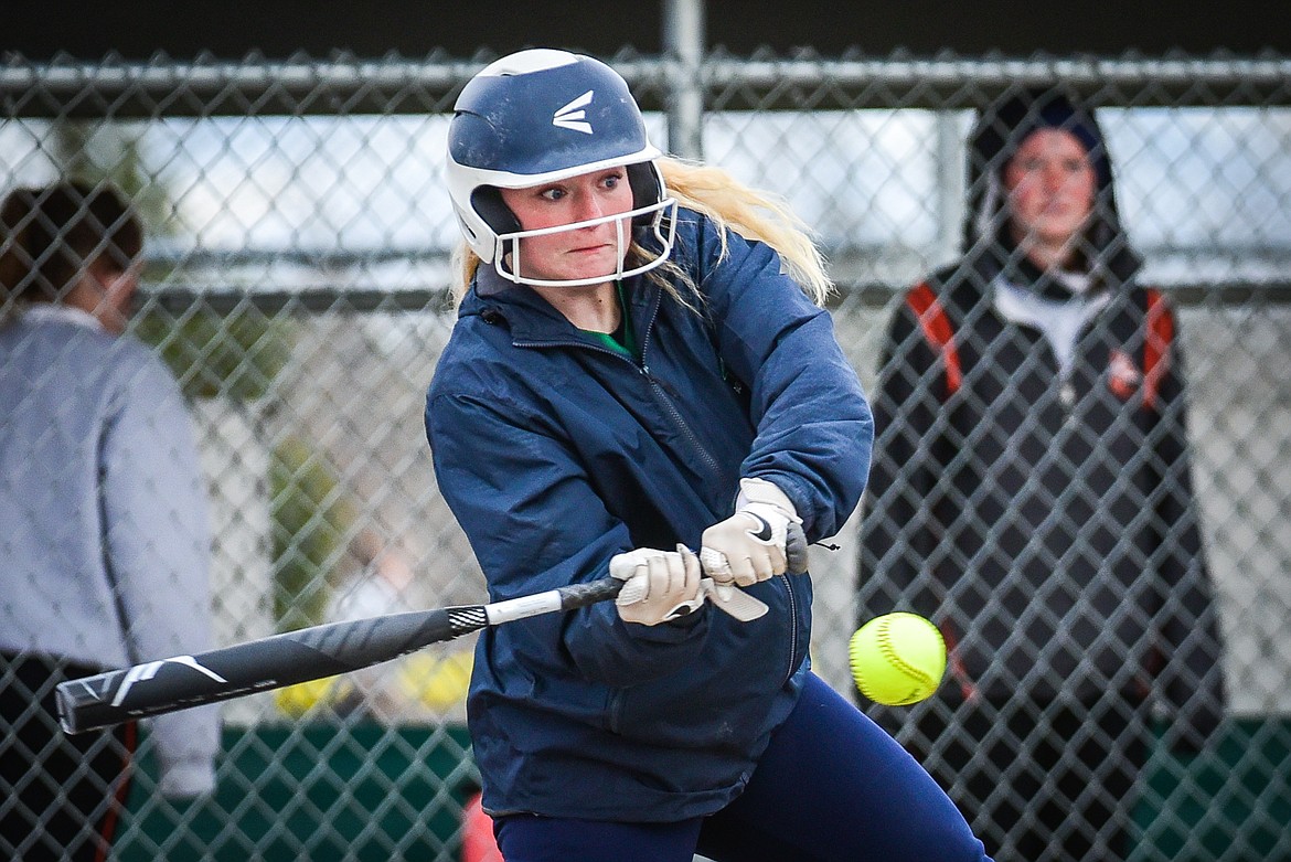 Glacier's Emma Cooke (11) connects on a single in the fifth inning against Flathead at Kidsports Complex on Thursday, April 20. (Casey Kreider/Daily Inter Lake)