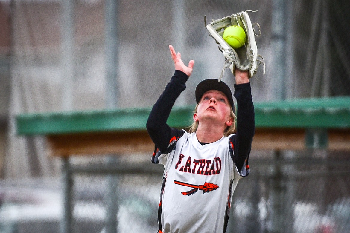 Flathead left fielder Sawyer VanCampen (24) squeezes a fly ball for an out in the first inning against Glacier at Kidsports Complex on Thursday, April 20. (Casey Kreider/Daily Inter Lake)