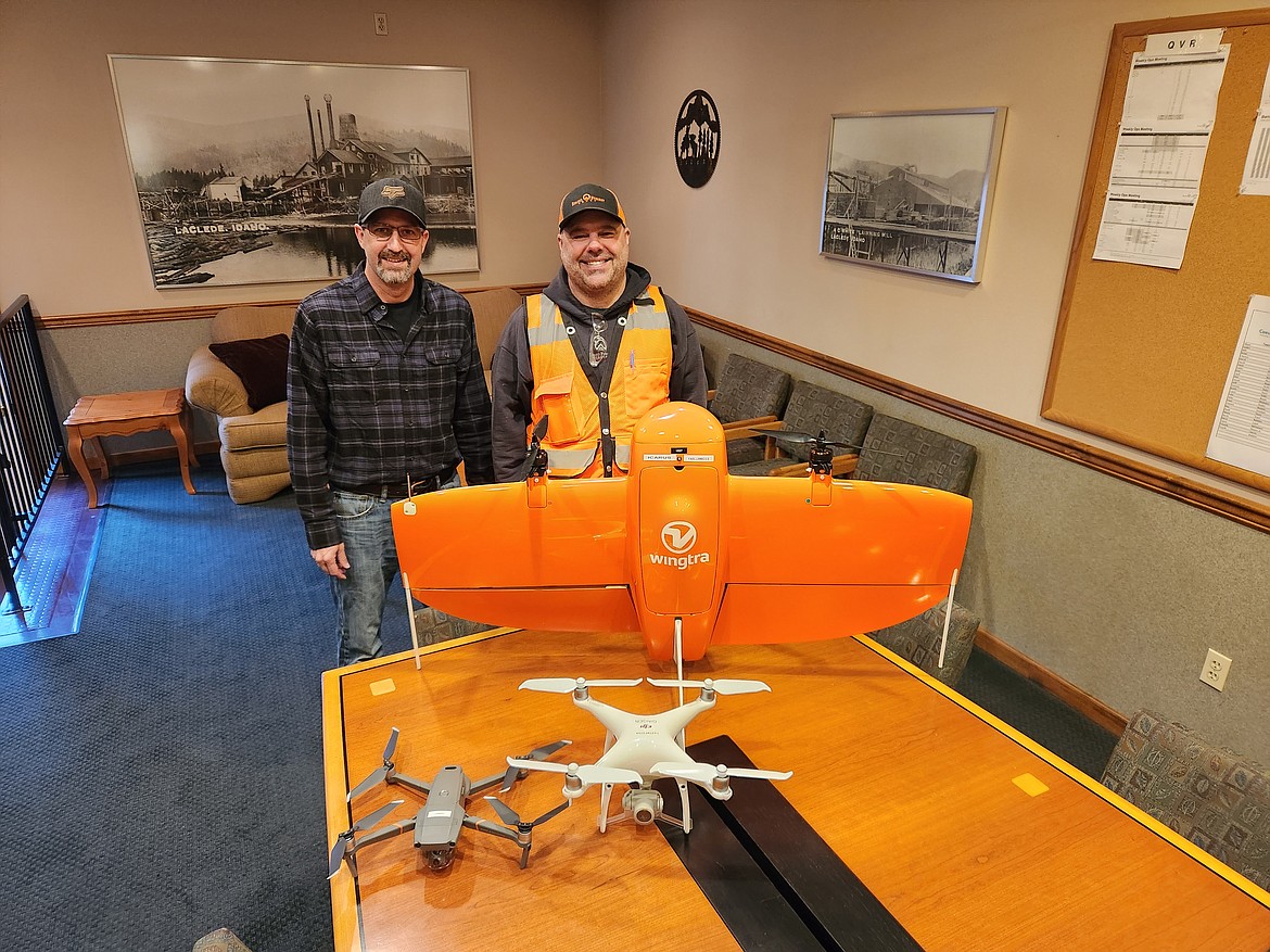 IFG plant superintendent Tommy Groff and log yard manager Eddie Gordon pose with two of the mill's drones.