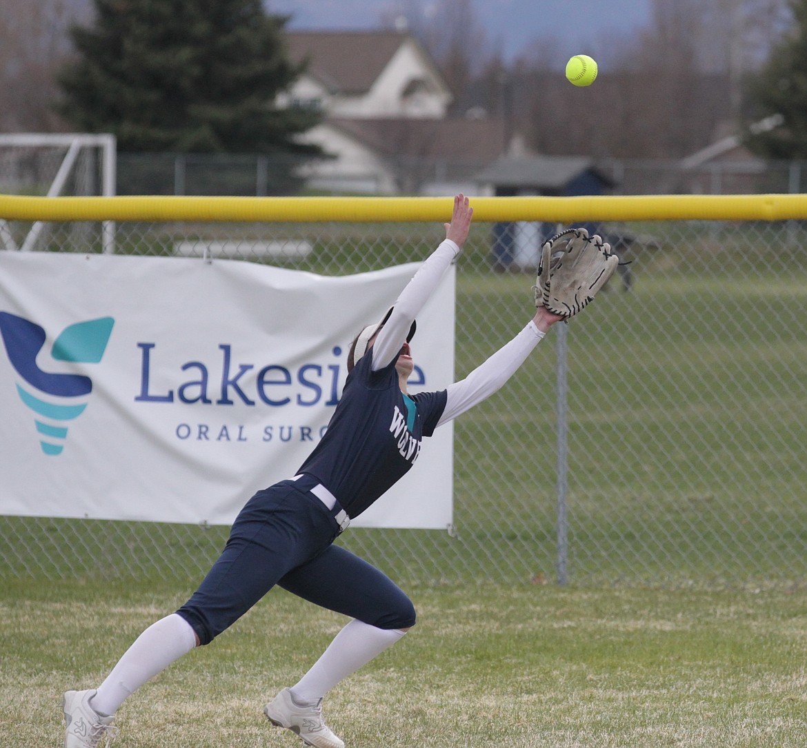 MARK NELKE/Press
Lake City right fielder Brooklyn Wullenwaber makes a valliant diving attempt on a triple by Chloe Burke of Coeur d'Alene in the first game of a doubleheader on Thursday at Lake City High.