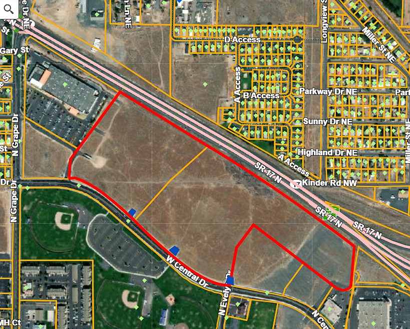 A map of the roughly 44 acres (highlighted in red) on the north side of Central Drive in Moses Lake owned by Ted Yao with the three “stub-outs” – roadway starts – for future street development noted in blue where a number of vehicles being used as residences have been parked.