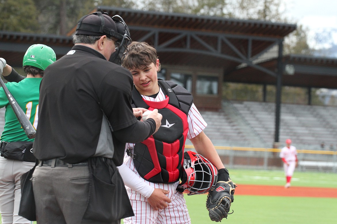 Gavin Day chats with the home plate umpire.