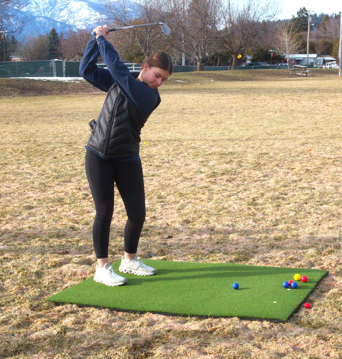 Avery Bayer practices driving at practice.