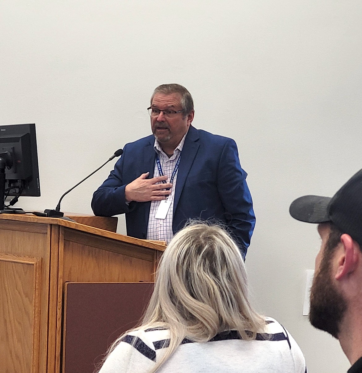 Human Resources Director Eric Davis of the Coeur d'Alene School District speaks in support of a formal financial emergency declaration Friday during a special meeting of the school board.