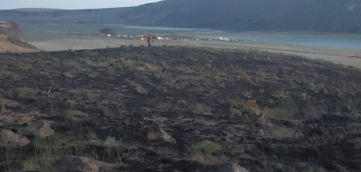 A wildfire near Soap Lake in 2021. Gov. Jay Inslee has signed into law a bill sponsored by Rep. Tom Dent, R-Moses Lake, that will require utilities in Washington to evaluate fire risks from power lines and limit those risks.