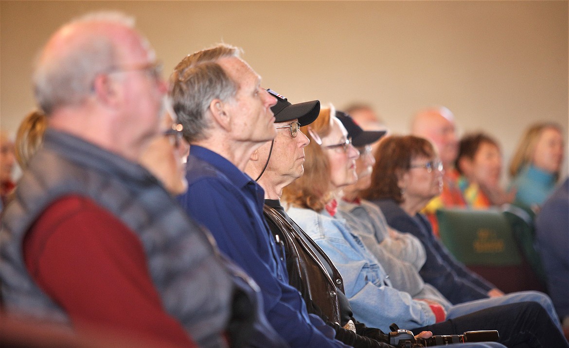 Members of the public listen during the town hall meeting at the Altar Church on Saturday.