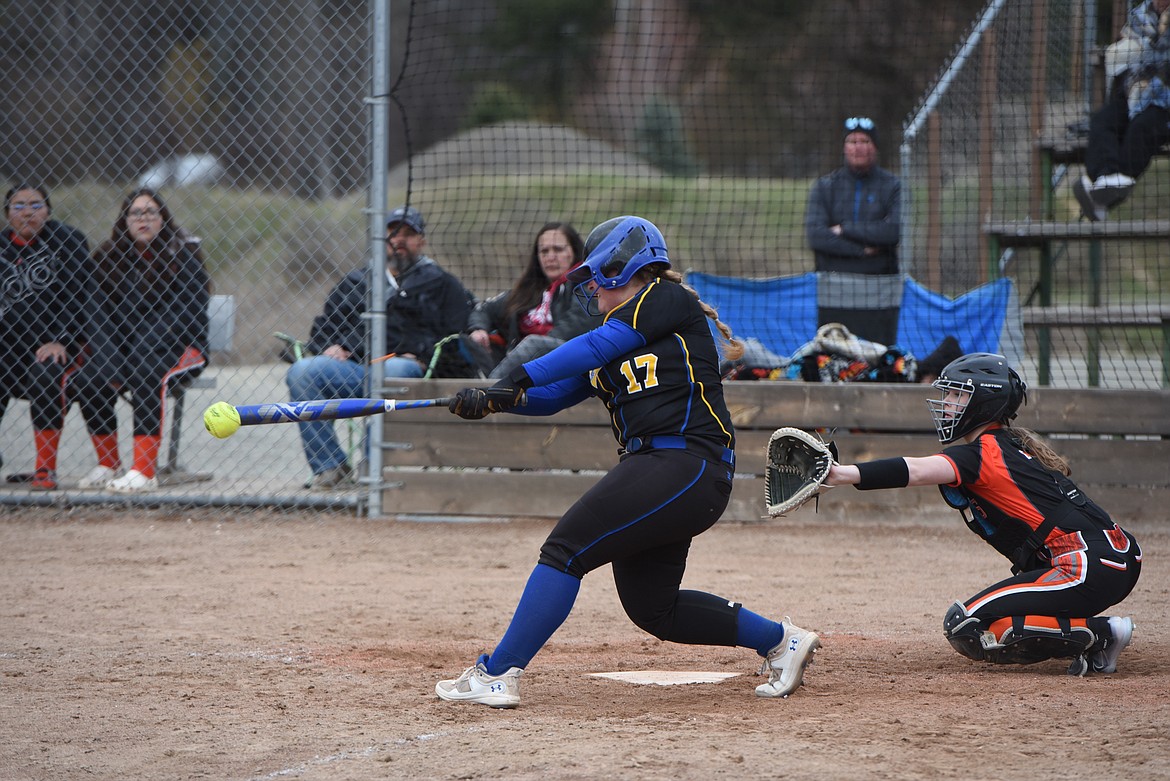 Libby's Aleesha Bradeen makes contact Saturday against Ronan. (Scott Shindledecker/The Western News)