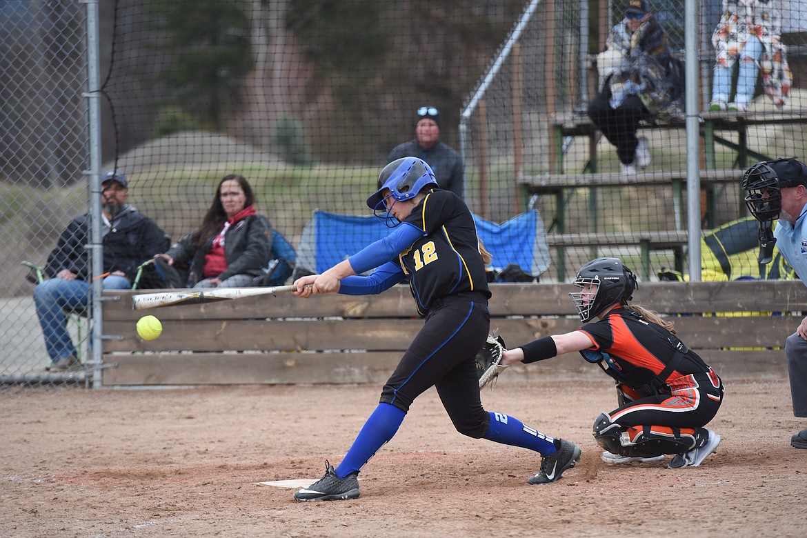 Libby's Jossalyn White lines a pitch for a hit Saturday against Ronan. (Scott Shindledecker/The Western News)