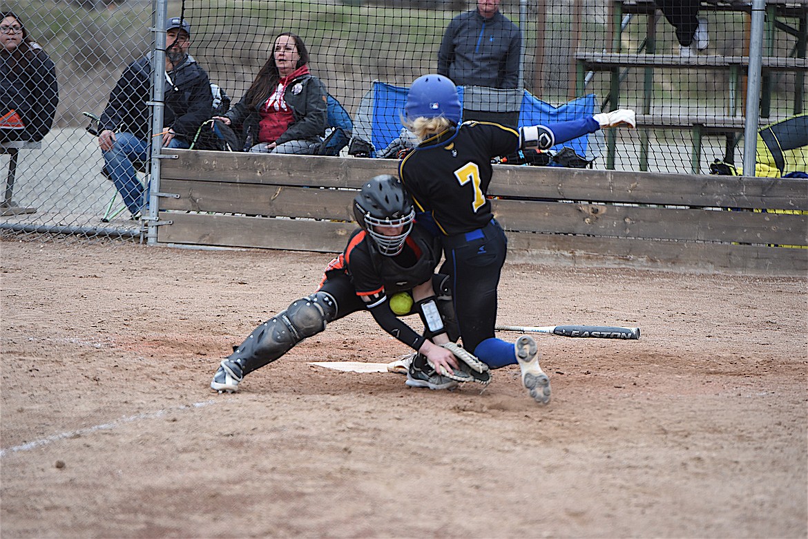 Libby's Mackenzie Foss scores a run to give the Lady Loggers a 7-5 lead in the bottom of the sixth inning Saturday against Ronan. (Scott Shindledecker/The Western News)