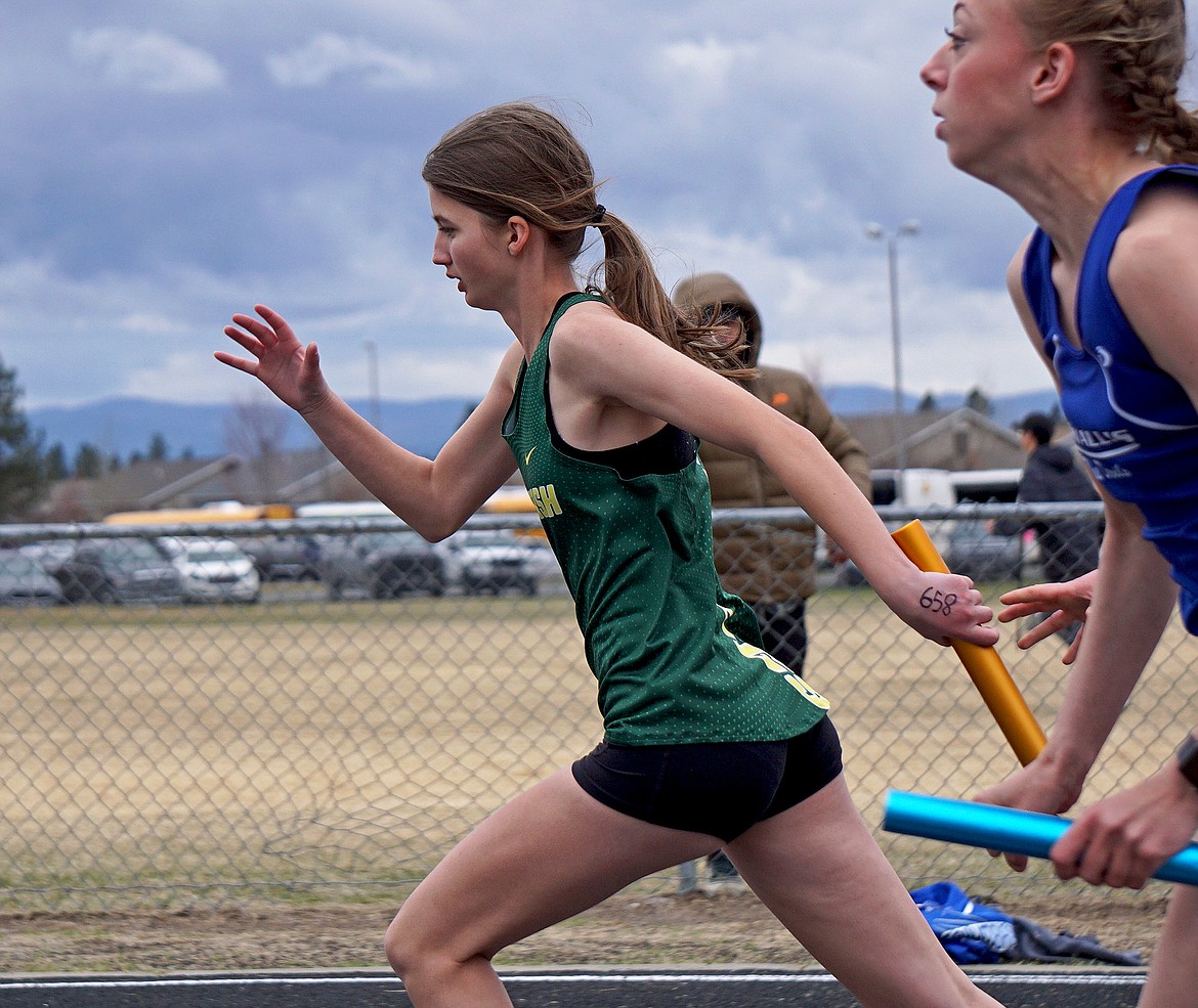 Whitefish freshman Arnica Beale runs the final leg of the girls JV 4X100 relay in Columbia Falls on Saturday. (Matt Weller photo)