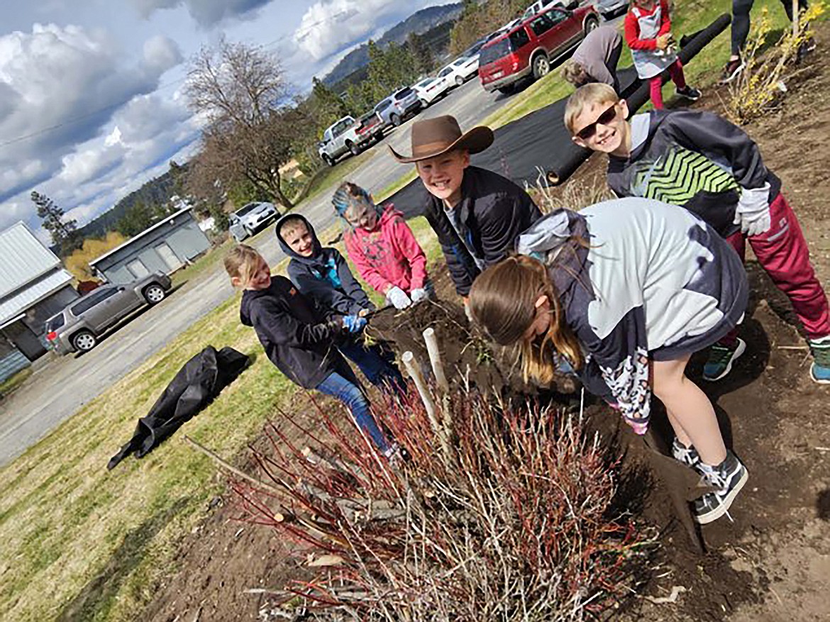 Idaho Hill second graders work during an Earth Day events at the school last week.