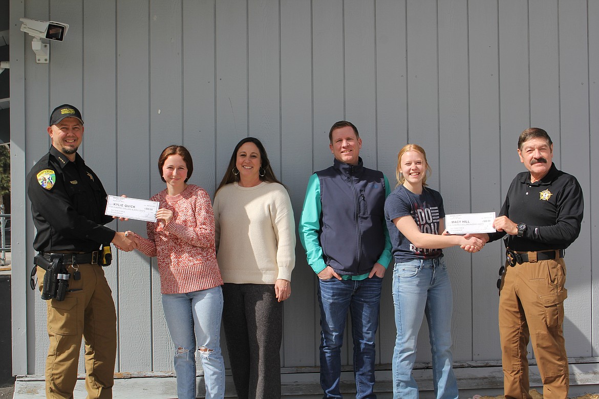 On left, Mineral County Sheriff Ryan Funke hands Superior High School senior Kiley Quick her check for $500 as a recipient of this year’s DUI Task Force scholarship program. On the right, Macy Hill from St. Regis accepts her scholarship check from DUI Task Force Coordinator Ernie Ornelas. Middle, Stephanie Quick is the secretary of the DUI Task Force standing next to Superior high school counselor Byron Quinlivan who helps coordinate the application process to all three schools in the county.