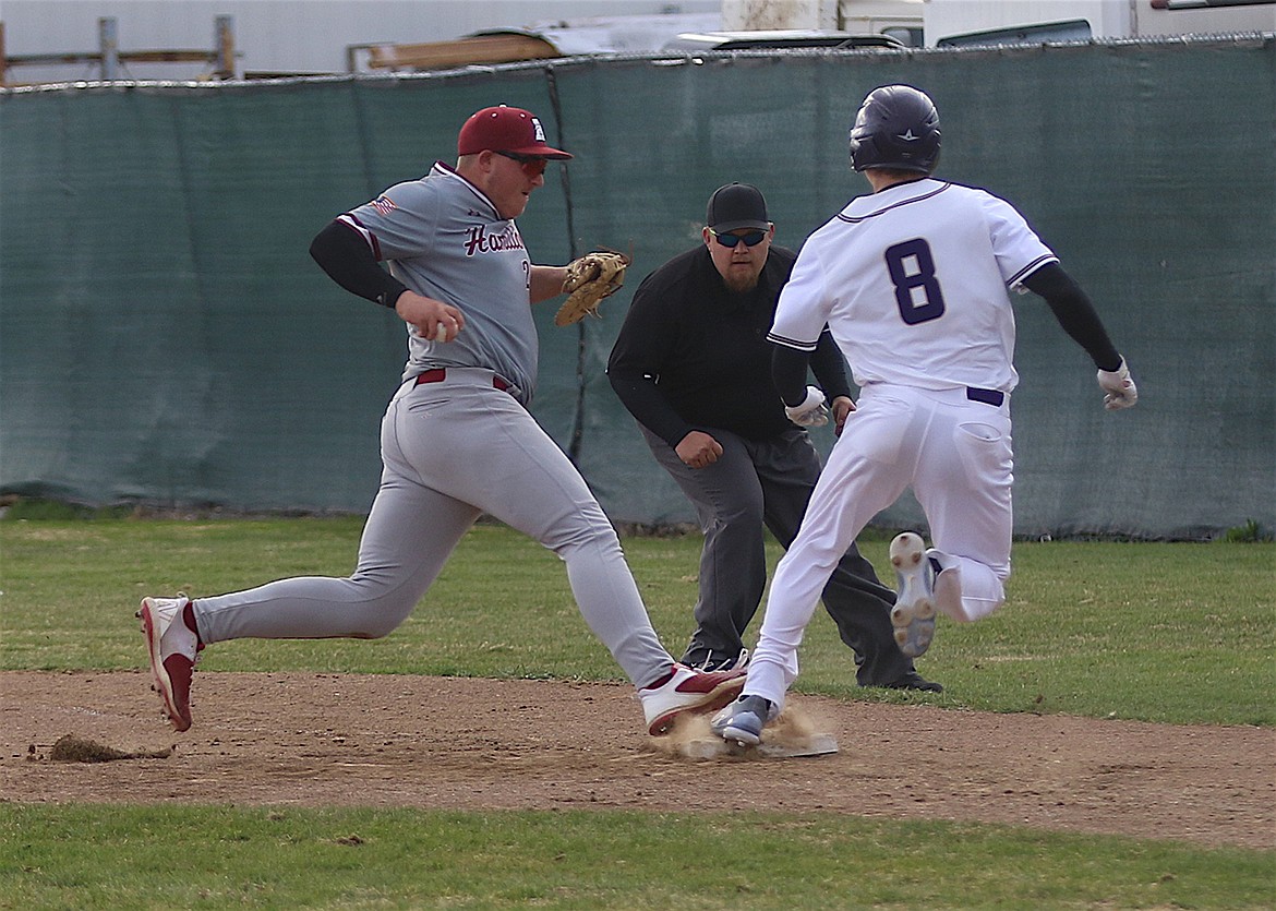 Polson's Jarrett Wilson is safe at first during Saturday's game against Hamilton. (Bob Gunderson)