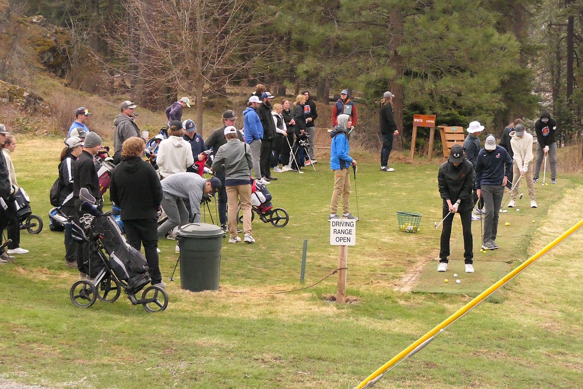 Golfers from schools throughout the area get in a little pre-tournament practice prior to the start of Saturday's Gary Thompson Invitational tourney at River's Bend Golf Course. (Chuck Bandel/VP-MI)