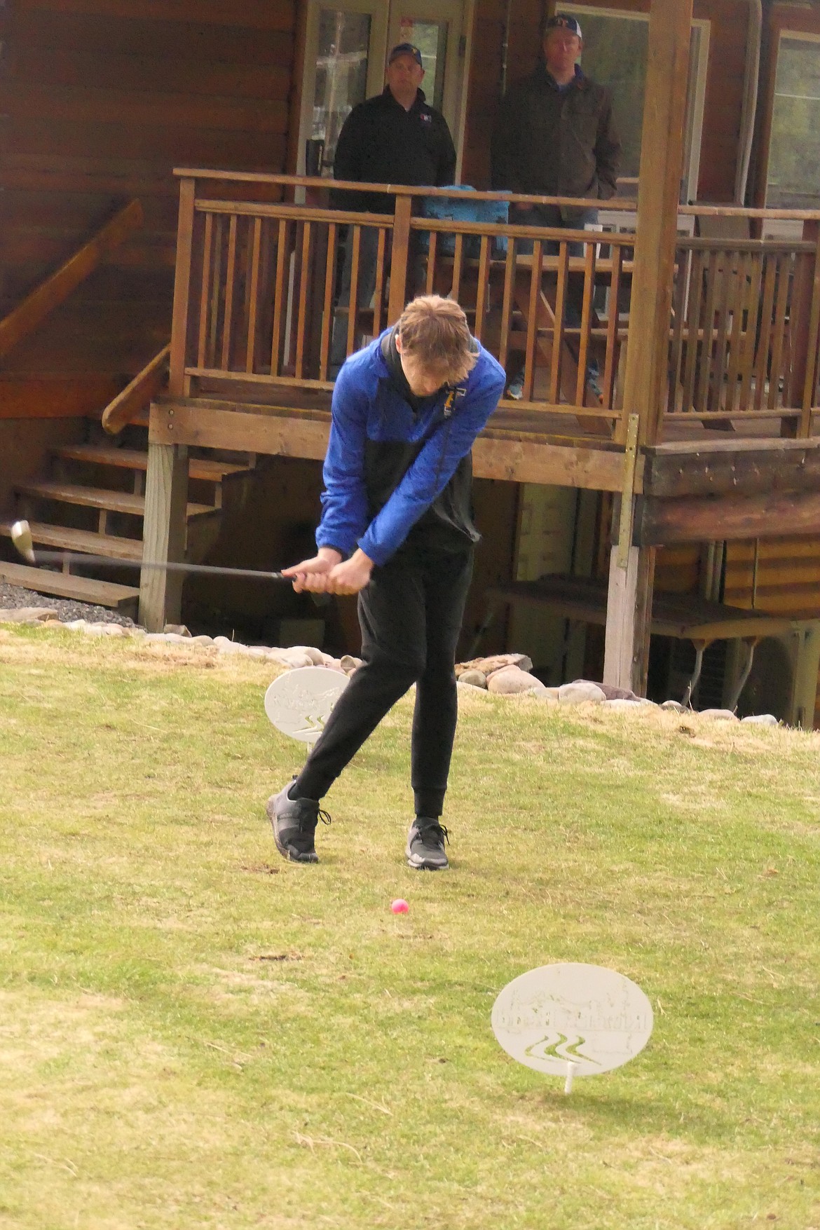 Thompson Falls senior golfer Jesse Claridge tees off nearby the clubhouse during the Gary Thompson Invitational tournament at River's Bend Golf Course. (Chuck Bandel/VP-MI)