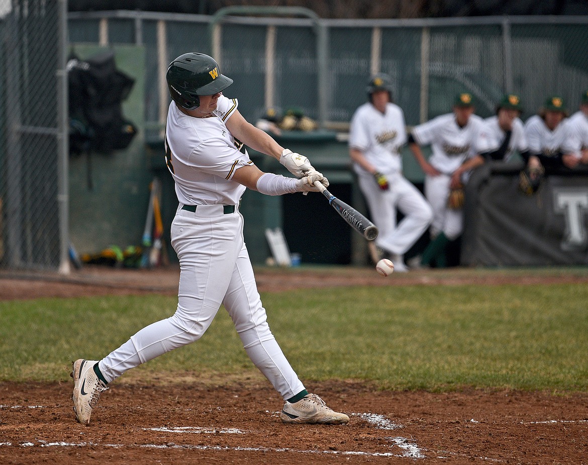 Bulldog senior Ty Schwaiger gets a base hit during a game against Corvallis on Thursday in Whitefish. (Whitney England/Whitefish Pilot)