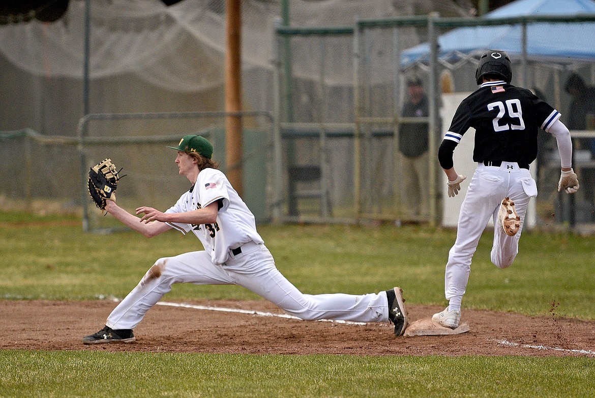 Bulldog first baseman Josiah Ruther makes a play to record an out against Corvallis on Thursday in Whitefish. (Whitney England/Whitefish Pilot)