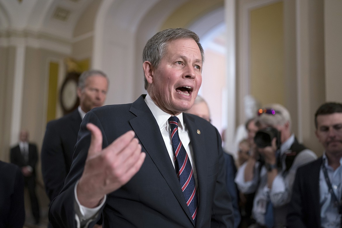 Sen. Steve Daines, R-Mont., speaks to reporters after the Republican leadership held a closed-door strategy session, at the Capitol in Washington, Tuesday, April 18, 2023. Former President Donald Trump has gotten his most high-profile endorsement from a Senate Republican yet, winning the backing of Montana’s Steve Daines, chief of the Senate’s GOP fundraising arm. (AP Photo/J. Scott Applewhite, File)