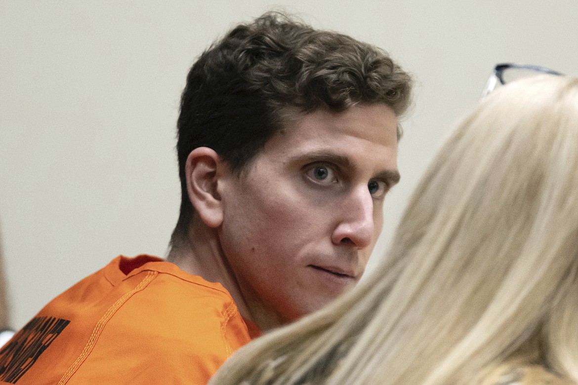 Bryan Kohberger, left, who is accused of killing four University of Idaho students in November 2022, looks toward his attorney, during a hearing in Latah County District Court, Jan. 5, 2023, in Moscow, Idaho. The Idaho Supreme Court on Monday, April 24, 2023, rejected a request by 30 news organizations to lift a gag order in the criminal case of Kohberger. (AP Photo/Ted S. Warren, Pool,File)