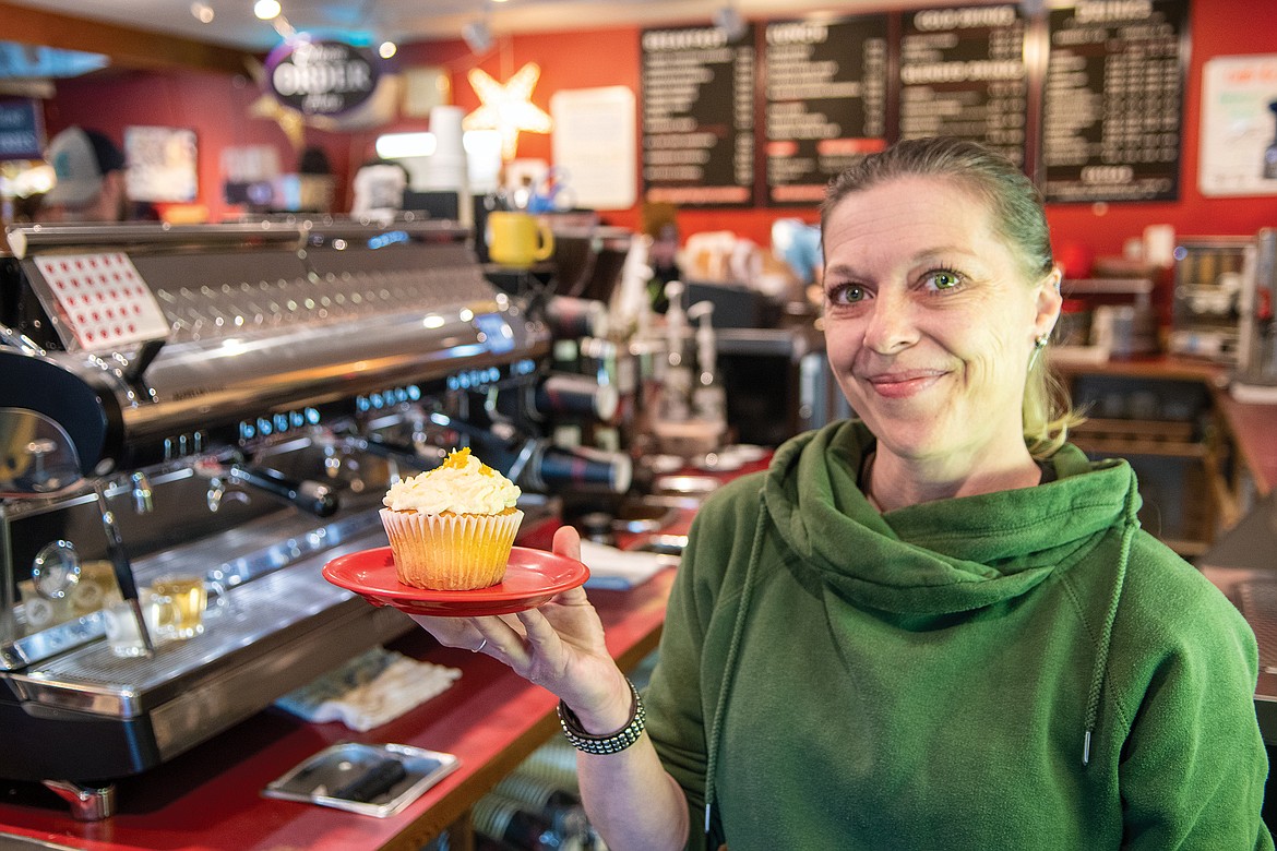 Shekinah King holds a cupcake, at Montana Coffee Traders in Columbia Falls was named best bakery.