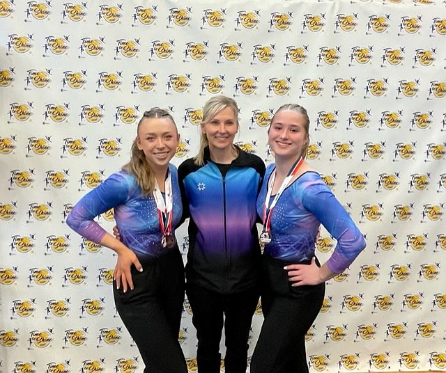 Courtesy photo
GEMS Athletic Center gymnasts Taryn Olson, left, coach Meloney Butcher and McKenzie Palaniuk at the Xcel Region 2 championships last weekend in Everett, Wash.