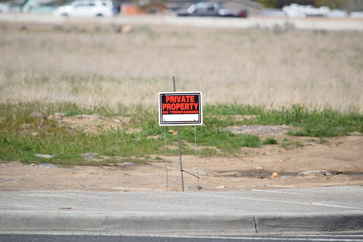 One of several “Private Property” signs posted along the north side of N. Central Drive, where nine RVs being used as residences are parked.