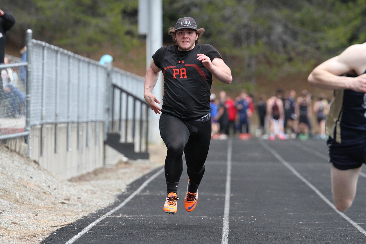 Jesse Poisel finishes the 100-meter dash at the Priest River Invitational with a new season best of 13.77 seconds. In the shot put, Poisel also finished with a new season best mark of 35-5.