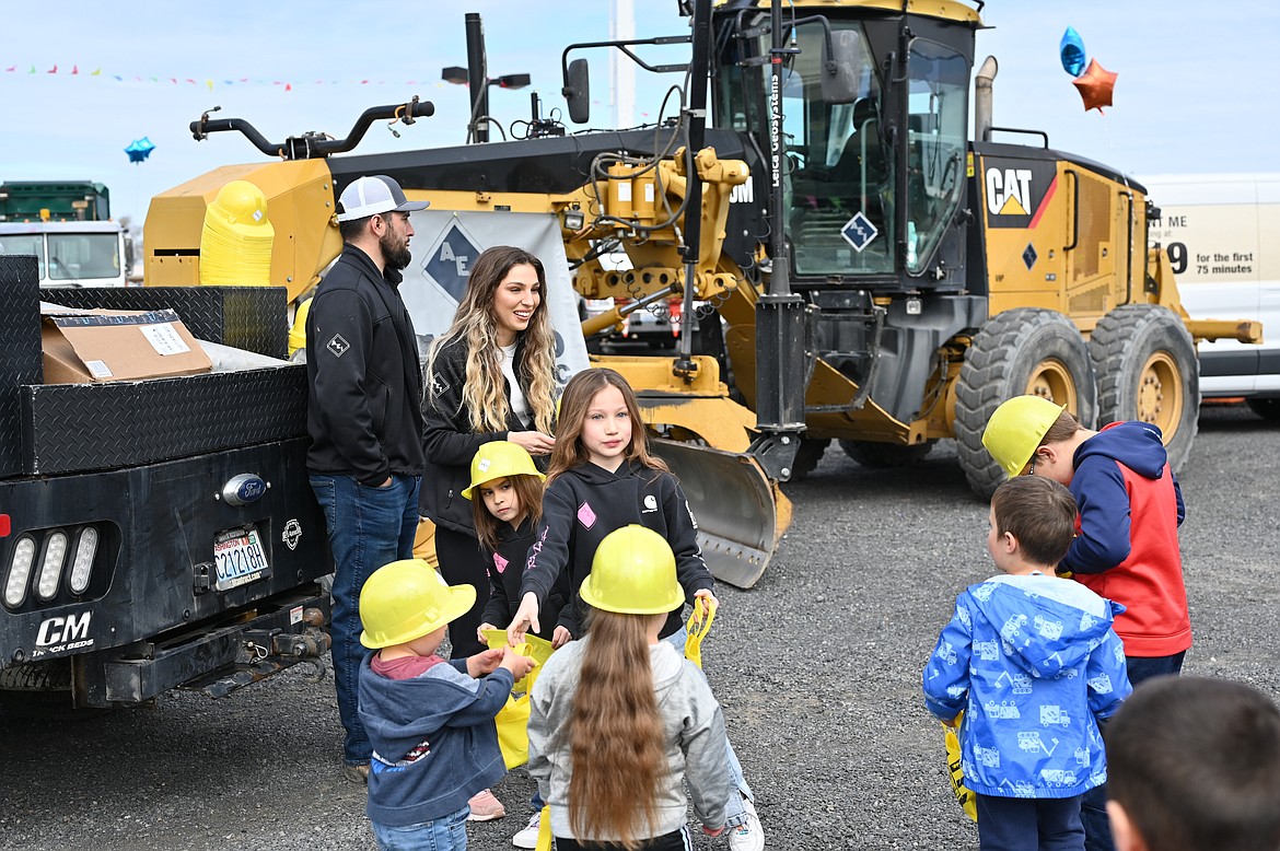 A family enjoys a sunny Saturday at the Mothers of Preschoolers annual Touch a Truck fundraiser in Moses Lake.