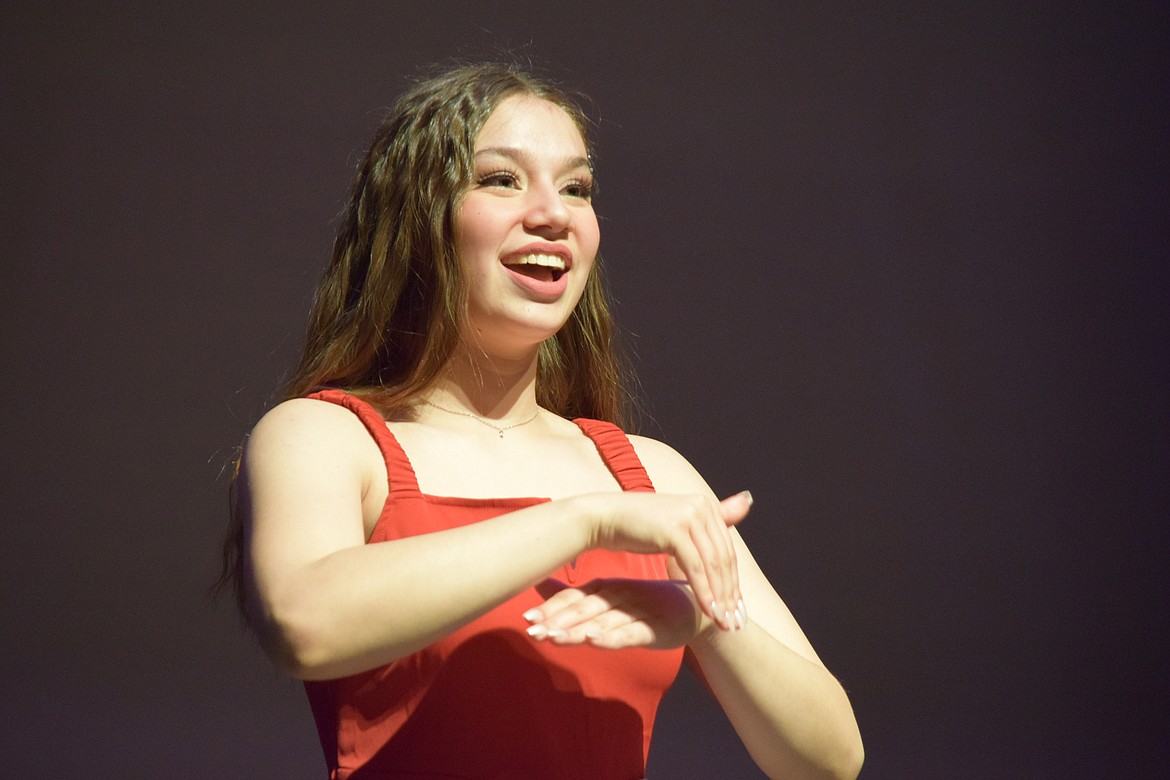 Sydney Garza performs the Star-Spangled Banner in American Sign Language during the talent portion of the Distinguished Young Women competition on Saturday.