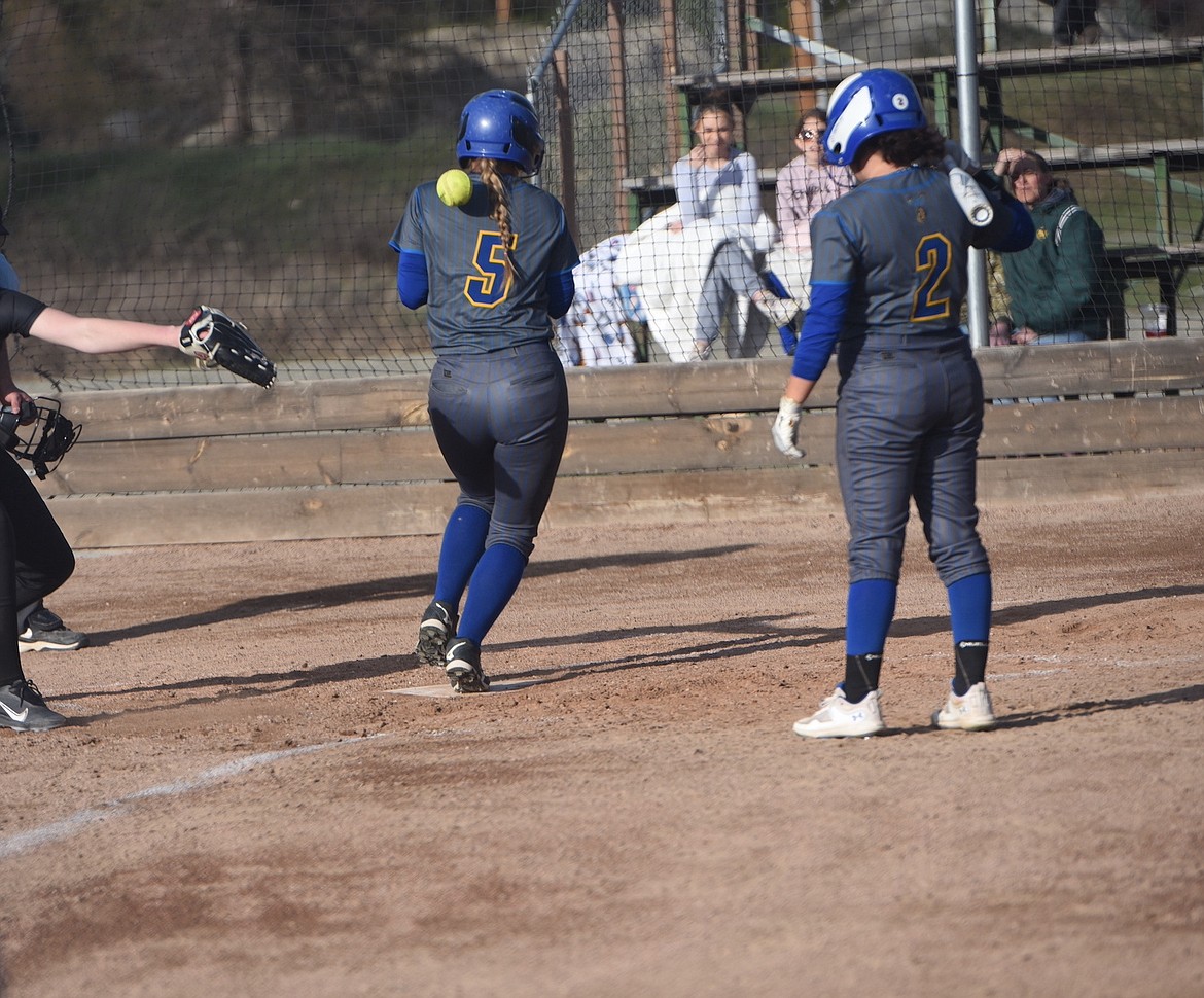 Libby's Peyton Waggoner scores a run against Whitefish in Tuesday's game. (Scott Shindledecker/The Western News)