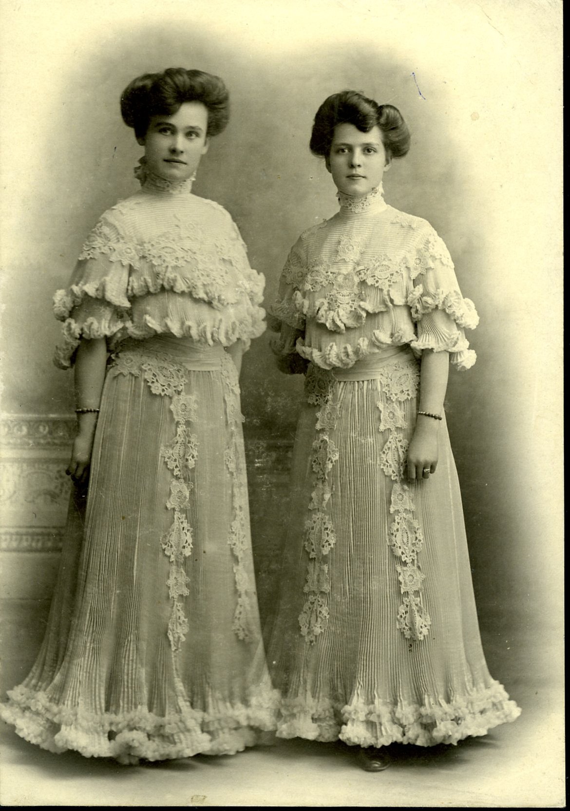 A photo of two women in elegant dresses, names are unknown, circa 1900. (courtesy  of the Northwest Montana History Museum)