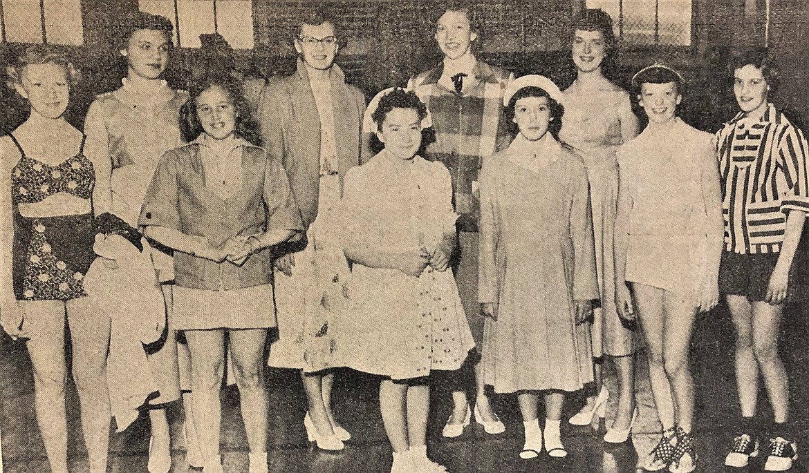 Future mayor Sandi (Crimp) Bloem (front row, second from left) and Ruthanna (Hawkins) Rauer (top row, far left) at Camp Fire Girls fashion show.