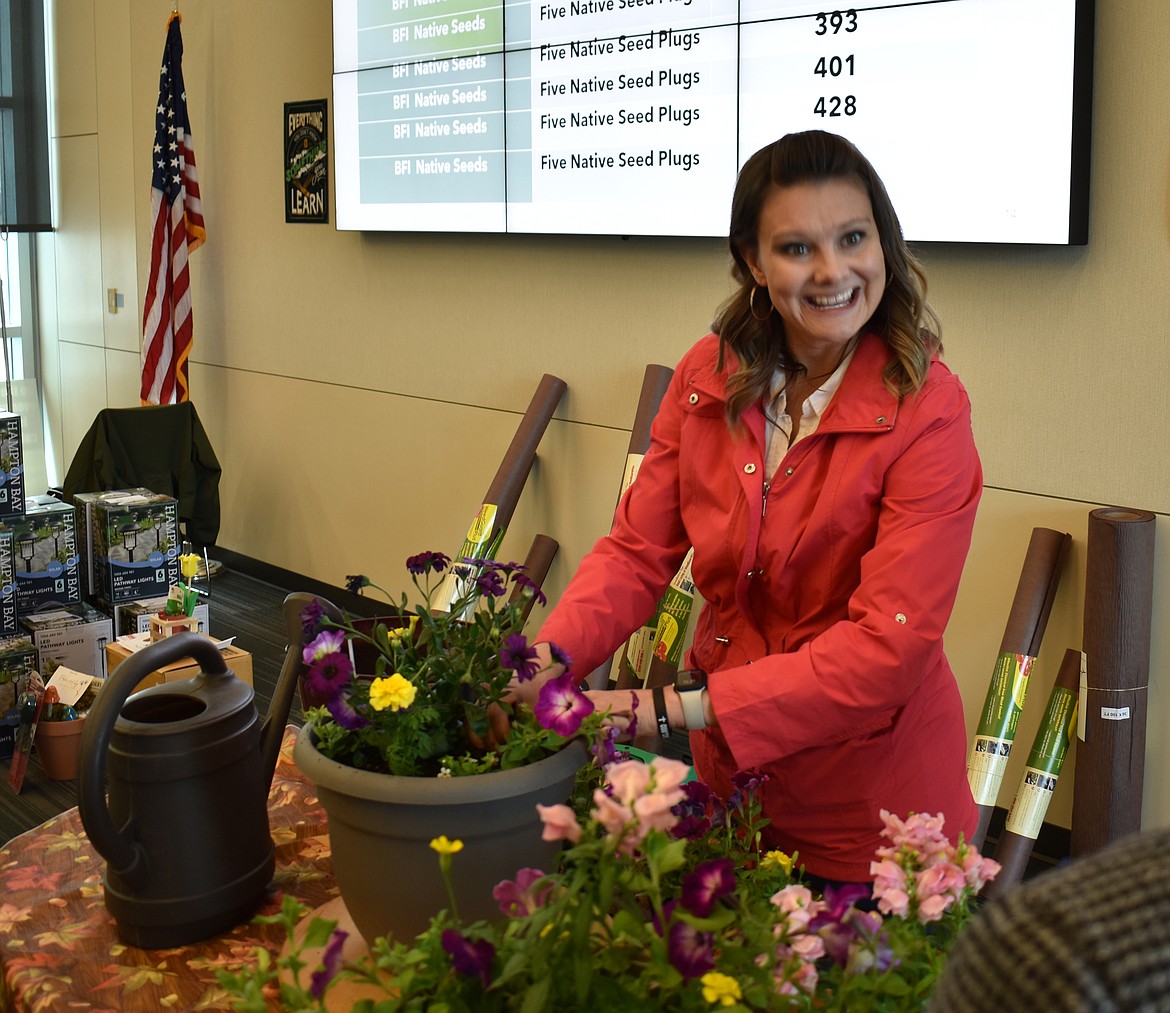 WSU Master Gardener Bobbie Bodenman demonstrates planting techniques at the Columbia Basin Eco-Gardening Symposium Saturday.