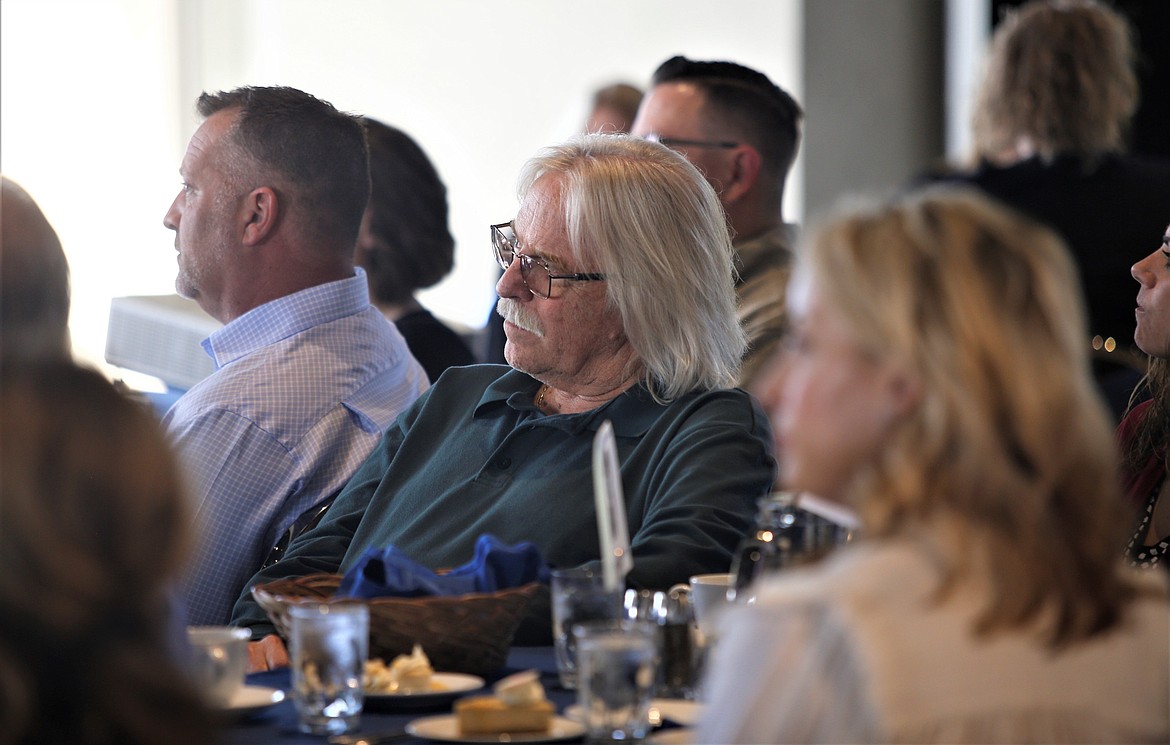 Coeur d'Alene Councilman Woody McEvers listens to Mayor Jim Hammond speak during the Coeur d'Alene Regional Chamber of Commerce's luncheon at the Hagadone Events Center on Wednesday.