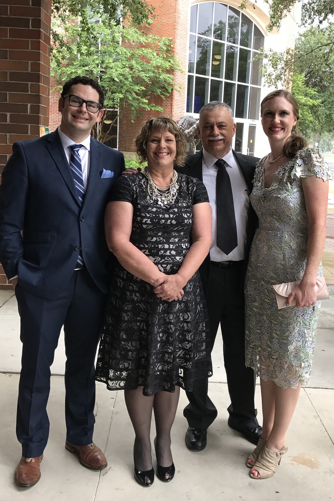 Seth Oliveria and his family are seen here at his 2017 graduation from neurosurgery residency at the University of Florida (Gainsville, Fla.). From left: Seth, mother Brenda, father Dave and wife Stephanie.