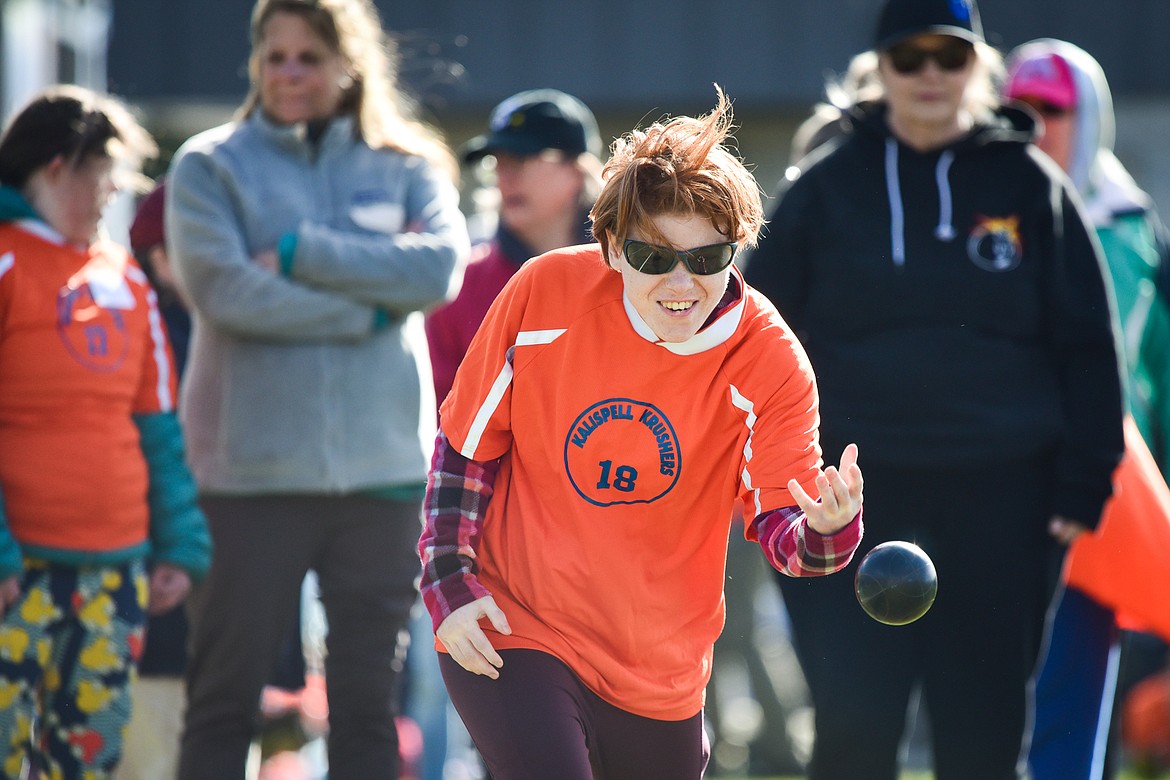 Kayla Burns with the Kalispell Krushers team tosses the bocce ball at the Special Olympics Glacier Area Spring Games outside Legends Stadium in Kalispell on Thursday, April 27. The games continue Friday with track and field and cycling at Legends Stadium and aquatics at Logan Health Medical Center. (Casey Kreider/Daily Inter Lake)